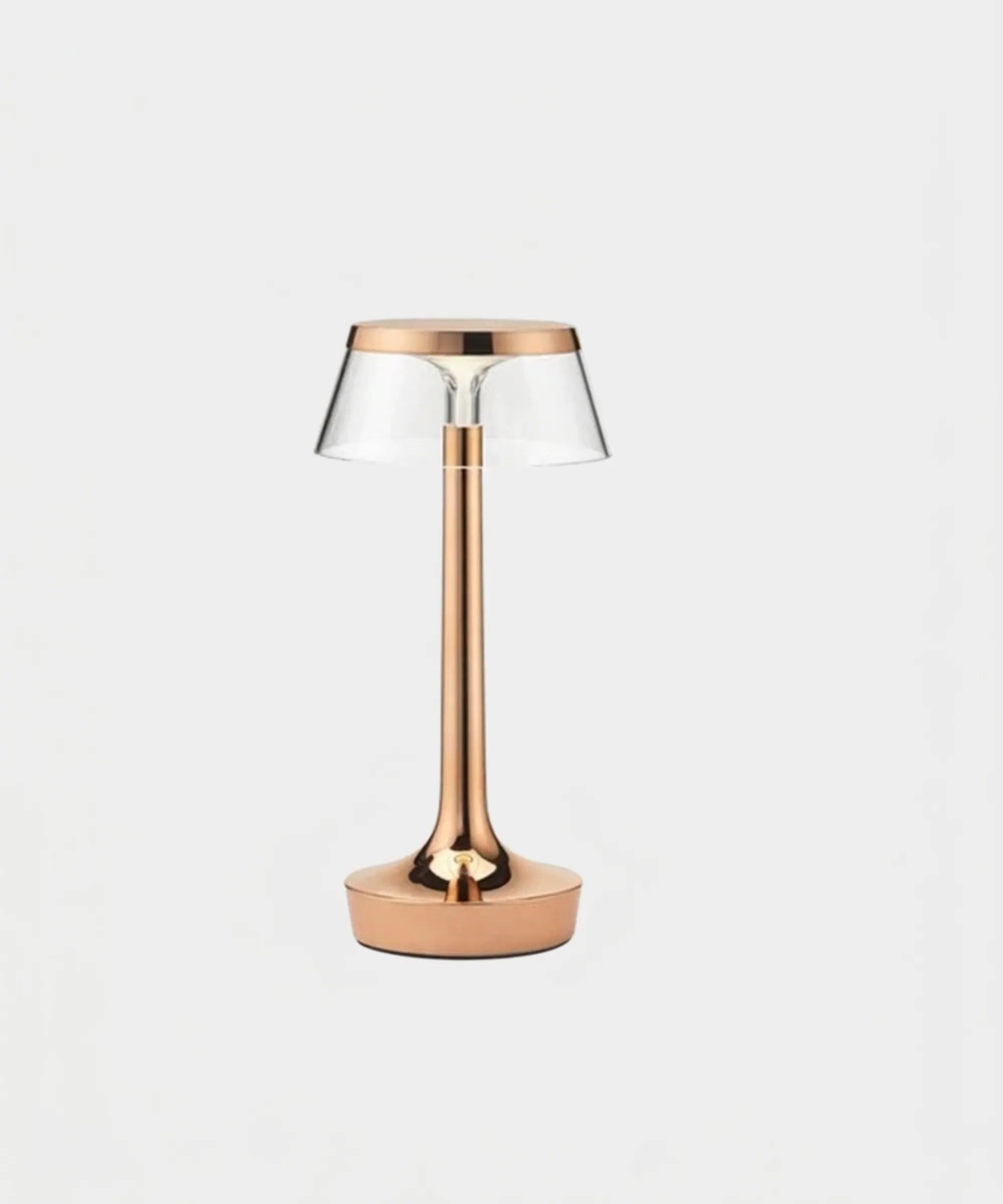 Lampada da tavolo portatile Flos Bon Jour Unplugged Anniversary Edition in finitura rame con corona trasparente in PMMA